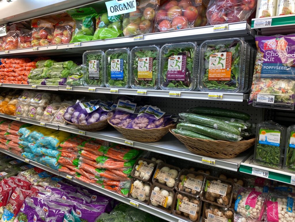 Fresh organic vegetable selection in produce aisle at grocery store  supermarket. Stock Photo